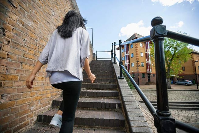 Woman-stairs-Depositphotos_57283799_xl-2015-1