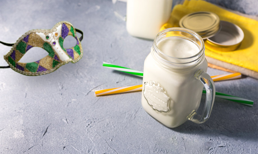 vanilla shake in mason jar with mardi gras mask